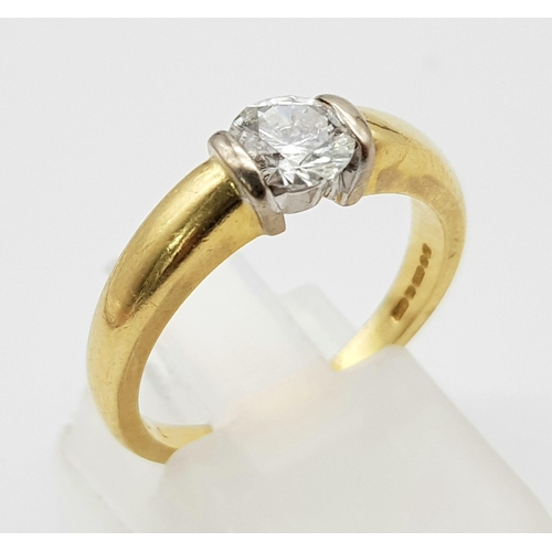 50 - An 18K Yellow Gold Diamond Solitaire Ring - With GIA certificate. A round brilliant cut diamond - 0.... 