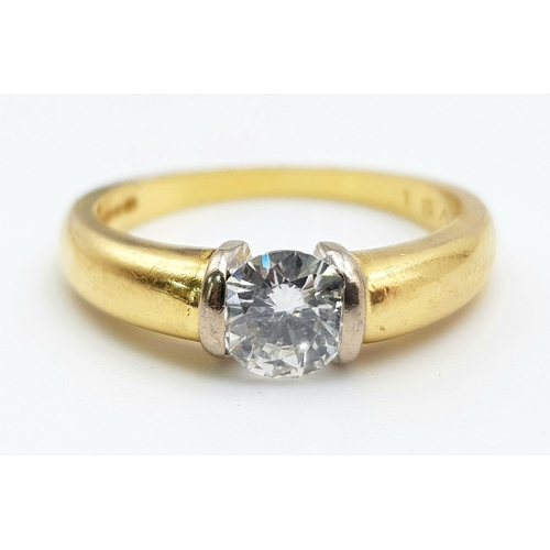 50 - An 18K Yellow Gold Diamond Solitaire Ring - With GIA certificate. A round brilliant cut diamond - 0.... 