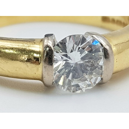 50 - An 18K Yellow Gold Diamond Solitaire Ring - With GIA certificate. A round brilliant cut diamond - 0.... 