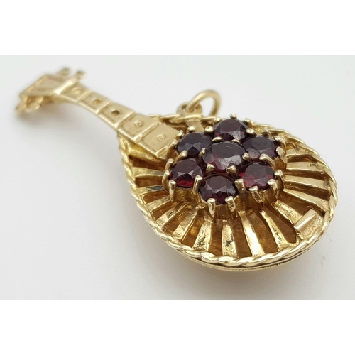 482 - A Wonderful Vintage 9K Yellow Gold and Garnet Lute Pendant/Charm. Seven garnets create the perfect n... 