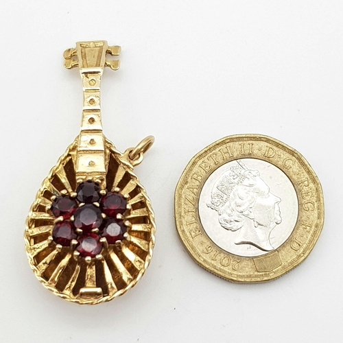 482 - A Wonderful Vintage 9K Yellow Gold and Garnet Lute Pendant/Charm. Seven garnets create the perfect n... 