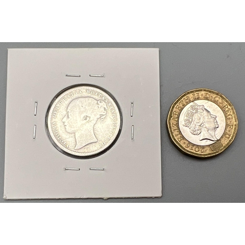 902 - An 1875 Queen Victoria Silver Shilling Coin. Please see photos for conditions.