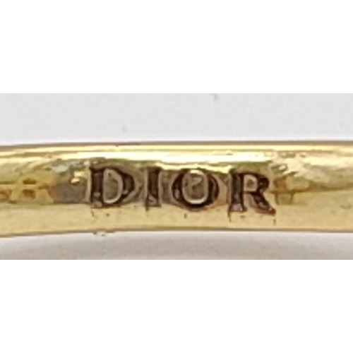 111 - An iconic and rare, three finger CHRISTIAN DIOR spell-out ring designed by John Galliano, one of the... 