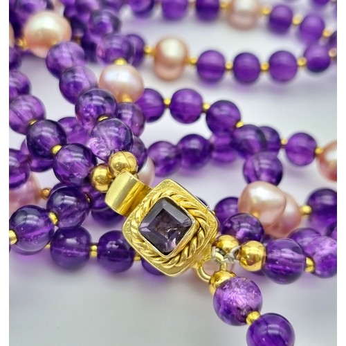 153 - A very feminine, three row necklace with round amethysts and pink, genuine, cultured pearls, with an... 