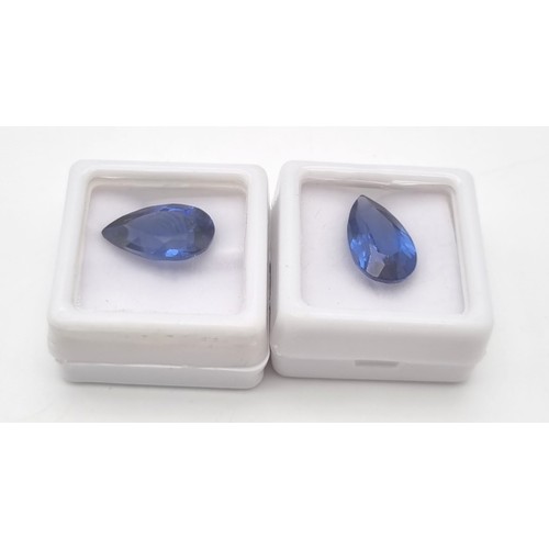 188 - A pair of pear cut, royal blue, tanzanite crystals. Dimensions: 16.11 x 9.62 x 6.74 mm and 16.39 x 9... 