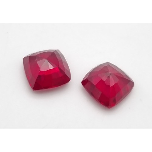 230 - A fabulous pair of cushion cut, bright red rubies. Dimensions: 11.54 x 11.28 x 7.85 mm and 11.46 x 1... 