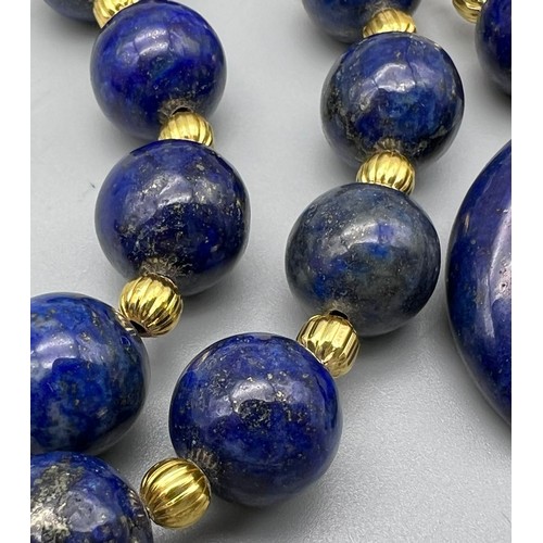 237 - A fashionable and unusual lapis lazuli necklace and earrings set with crescent carved pendants. Neck... 