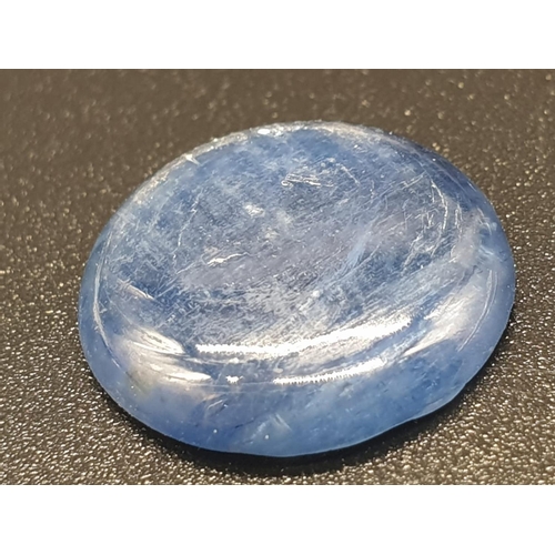 1220 - 6.82 Ct Kyanite. Round cabochon. IDT certified