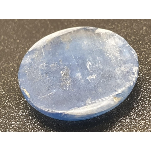 1220 - 6.82 Ct Kyanite. Round cabochon. IDT certified