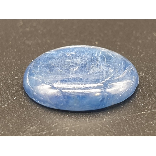 1220 - 6.82 Ct Kyanite. Round cabochon. IDT certified