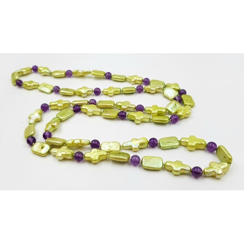 443 - A Freshwater Baroque Cross-Shaped Pearl and Amethyst Necklace. 44cm