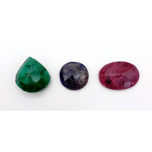 257 - Set of 3 Very Large Gems - Oval 123ct Ruby, Round 103ct Sapphire, 201ct Pear Shaped Emerald all with... 