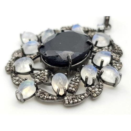 95 - A 925 Silver Blue Sapphire Pendant with a 28ct Sapphire. Moonstones and Real Diamonds Surround. UGL ... 