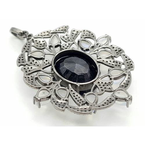 95 - A 925 Silver Blue Sapphire Pendant with a 28ct Sapphire. Moonstones and Real Diamonds Surround. UGL ... 