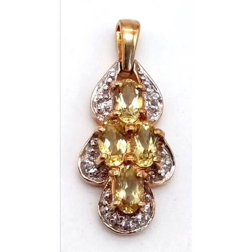 453 - A 9K Yellow Gold Citrine Pendant. Four oval cut citrines. 2cm. 2.42g total weight,