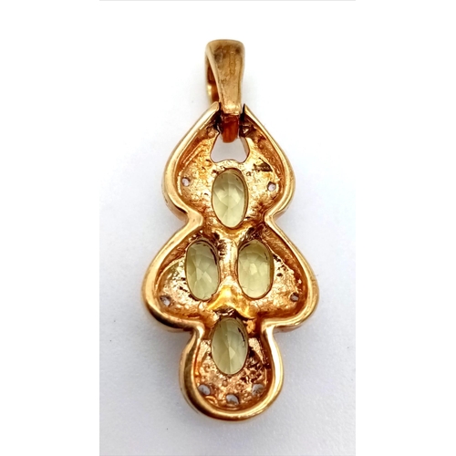 453 - A 9K Yellow Gold Citrine Pendant. Four oval cut citrines. 2cm. 2.42g total weight,