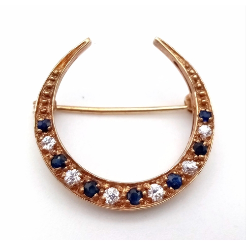 474 - A Vintage 9K Yellow Gold Sapphire and White Stone Crescent Moon Brooch. 23mm. 2.27g total weight