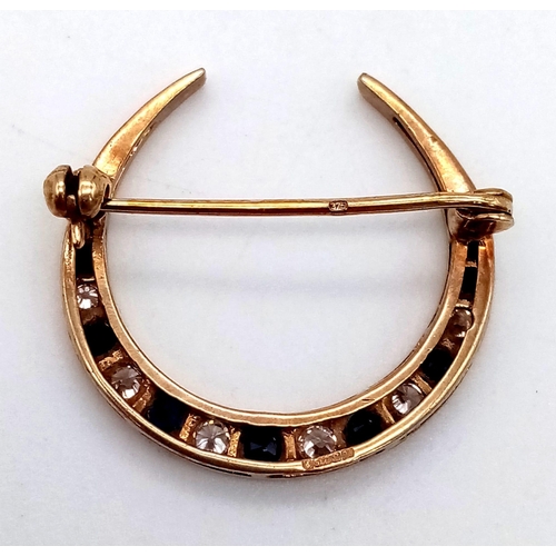 474 - A Vintage 9K Yellow Gold Sapphire and White Stone Crescent Moon Brooch. 23mm. 2.27g total weight