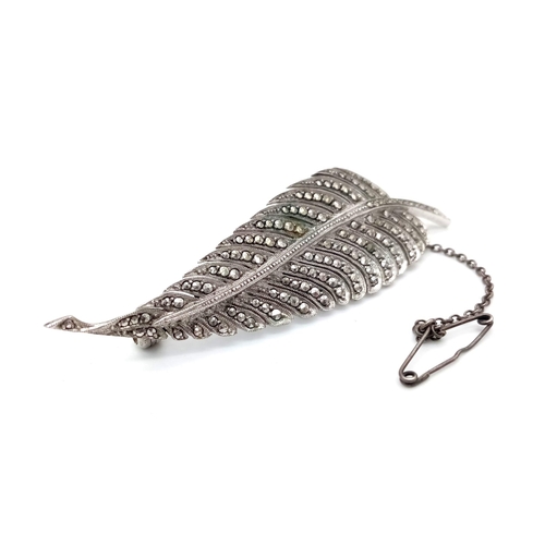 819 - A Beautiful Silver and Marcasite Feather Brooch. 7.5cm. 10.77g