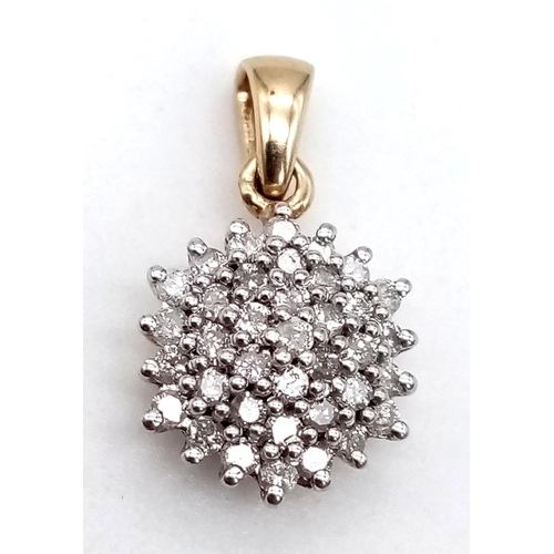 945 - A 9K Yellow Gold Diamond Cluster Floral Pendant. 10mm diameter. 1.85g total weight.