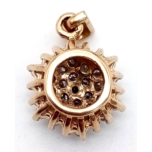 945 - A 9K Yellow Gold Diamond Cluster Floral Pendant. 10mm diameter. 1.85g total weight.