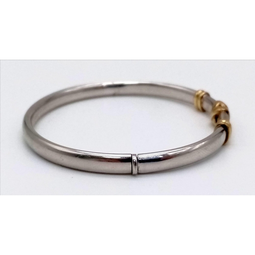 5 - A Stylish White and Yellow 9K Gold Bangle. Clip open for easy access. 10.13g. 6cm inner diameter.