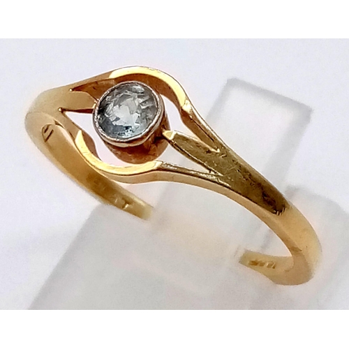 503 - An 18K Yellow Gold Topaz Solitaire Ring. Central pale blue topaz in an eye-shaped setting. Size O. 2... 