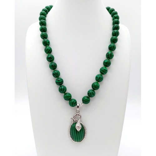 982 - A Green Malachite Bead Necklace and Pendant. 10mm beads. 4 and 42cm.