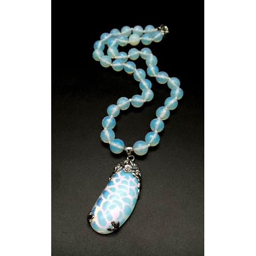 998 - A Moonstone Bead Necklace and Pendant. 10mm beads. 4.5 and 42cm.