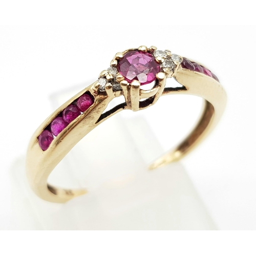 1013 - A 9K Yellow Gold Ruby and Diamond Trilogy Ring with Ruby Accents. Size O. 1.88g total weight.