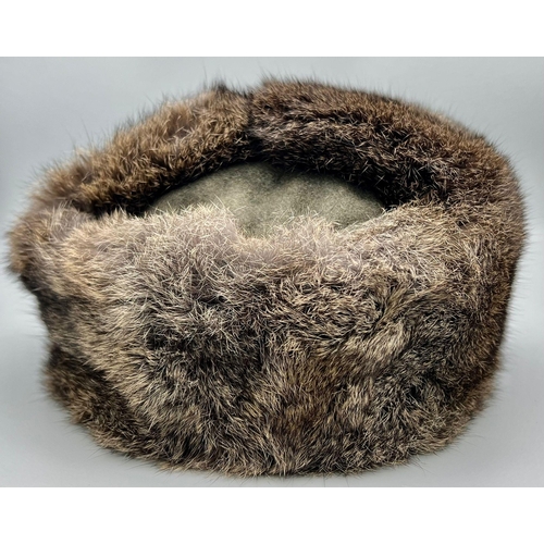 124 - A WW2 German 1942 Pattern Winter Hat. Nicknamed the “Russian Front” Cap. Badged to the Field Police.