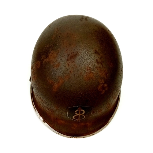 13 - A WW2 USA 8th Infantry Division M1 Swivel Bale Helmet with Westing-House Liner.