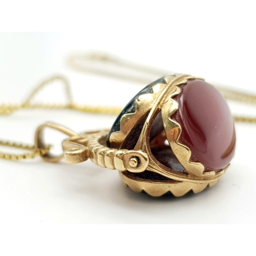 186 - An Antique Onyx, Bloodstone and Cornelian set in 9K Gold Spinning Fob on a rolled gold chain. 25mm a... 