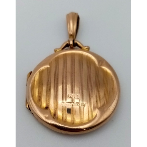 310 - An Edwardian 9k Yellow Gold Engine-Turned Locket. Hallmarks for Birmingham 1913. 43 x 29mm. 6.65g