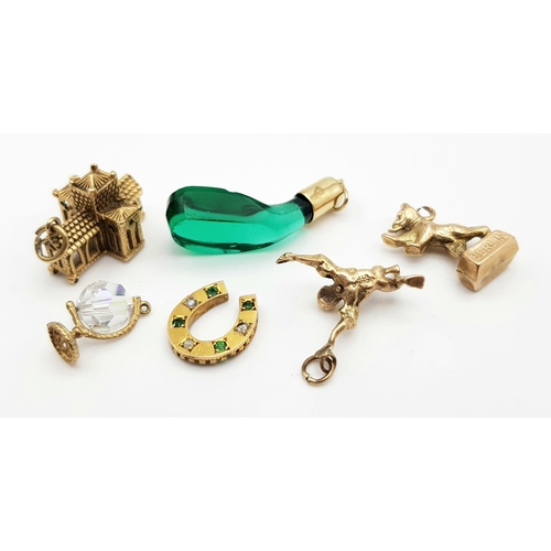 333 - A Collection of 9k Yellow Gold Charms - To include: A Victorian Emerald and pearl horseshoe charm. A... 