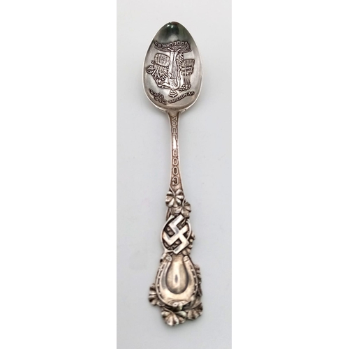 415 - AN ANTIQUE SILVER DECORATIVE TEASPOON MADE IN BRAZIL AND USING THE SWASTIKA WHEN IT DENOTED PEACE AN... 