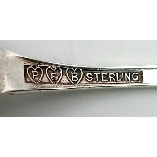 415 - AN ANTIQUE SILVER DECORATIVE TEASPOON MADE IN BRAZIL AND USING THE SWASTIKA WHEN IT DENOTED PEACE AN... 