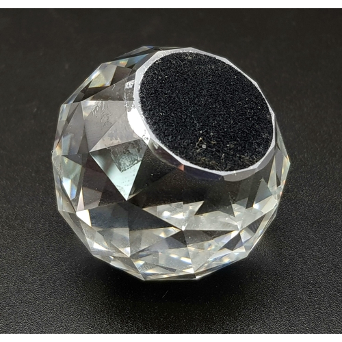 429 - A SWAROVSKI CRYSTAL CUT GLASS PAPERWEIGHT IN ORIGINAL BOX. 89.9gms   4cms diameter