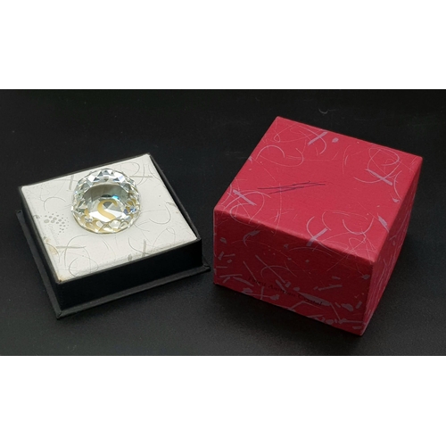 429 - A SWAROVSKI CRYSTAL CUT GLASS PAPERWEIGHT IN ORIGINAL BOX. 89.9gms   4cms diameter