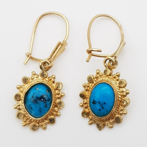 626 - A Pair of 9K Yellow Gold Turquoise Drop Earrings. 15mm drop. 1.5g total weight.