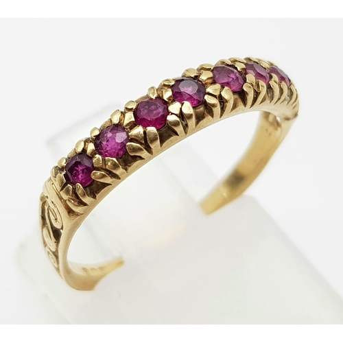 914 - A Vintage 9K Ruby Half-Eternity Ring. Seven rubies. Size N. 1.85g total weight.