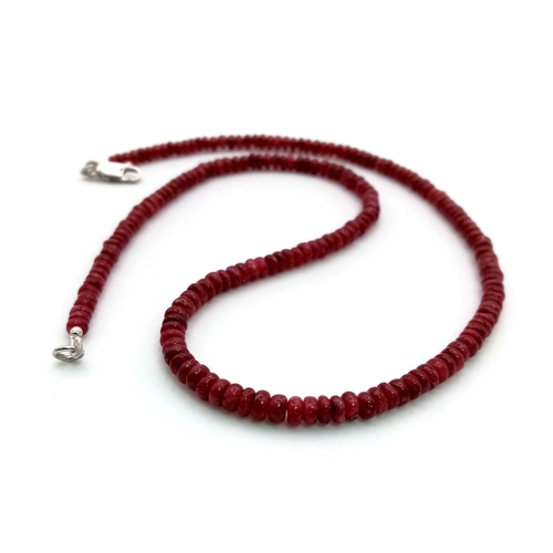 1052 - A 97ct Single Strand cabochon ruby gemstone necklace with 925 silver clasp. 44cm.