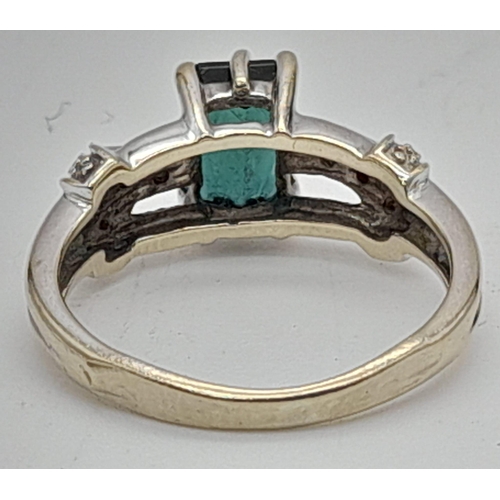 1231 - A 9K Gold Green Tourmaline Ring with Diamond Accents. Size K. 3.35g total weight.