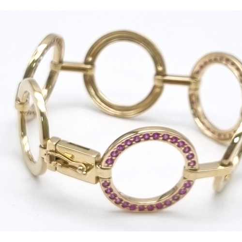 129 - A Gorgeous 9K Yellow Gold Pink Sapphire Circlet Bracelet. 78 round cut pink sapphires.  17cm. 22.95g... 