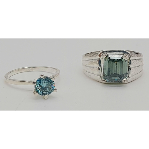 1296 - His and Hers 3.90ct Emerald Cut Blue Moissanite ring and a 1.10ct Blue Moissanite Ring. Both set in ... 