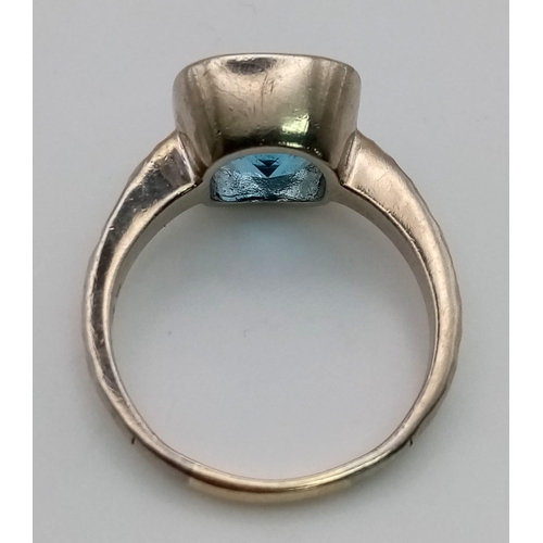 170 - A 9K White Gold Cushion-Cut Large Swiss-Blue Topaz Ring - Featuring Hammered Shoulders. Size U 1/2. ... 