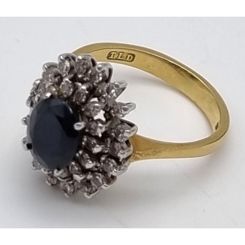 198 - A Beautiful Vintage 18K Yellow gold Sapphire and Diamond Ring. Large central sapphire surrounded by ... 