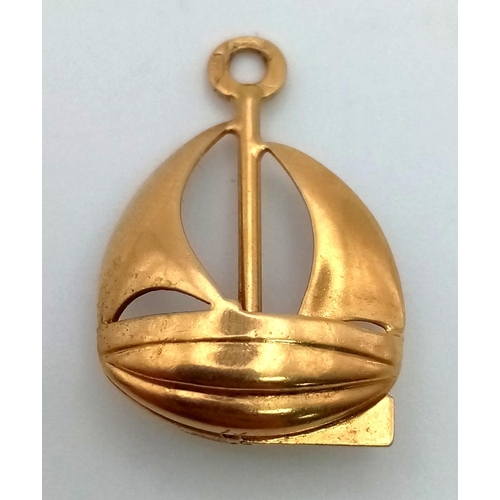 22 - An 18K Yellow Gold Sailing Boat Pendant or Charm. 16 x 16mm.  1.8g