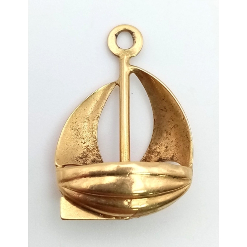 22 - An 18K Yellow Gold Sailing Boat Pendant or Charm. 16 x 16mm.  1.8g