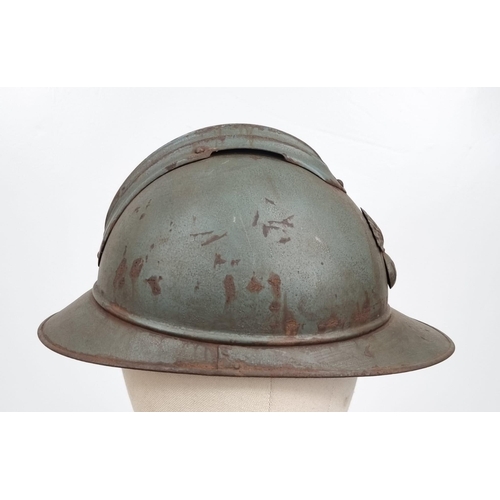 369 - A WW1 French 1915 Model Infantry Adrian Helmet with liner.